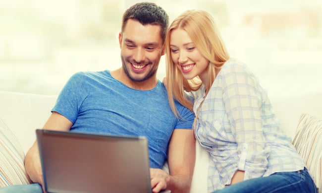 Couple-Checking-Supplemental-Insurance-Quote-On-Computer