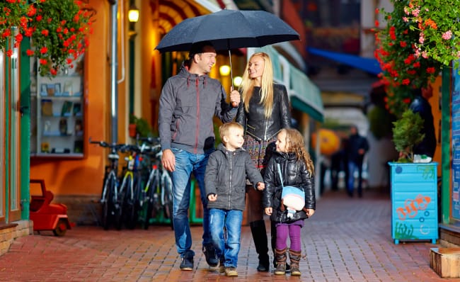 Family-Protected-From-Rain-While-Walking